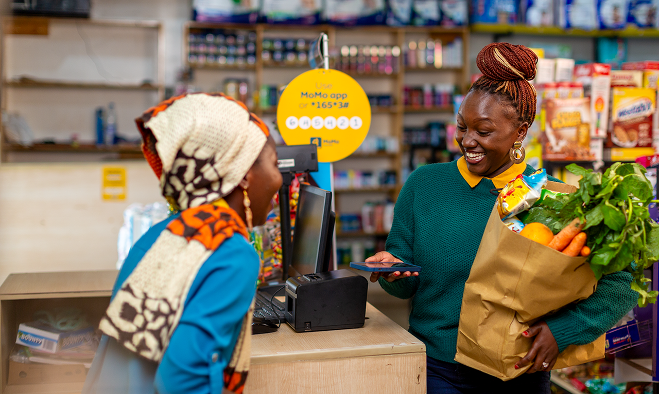 Lady with Groceries Paying with MoMo