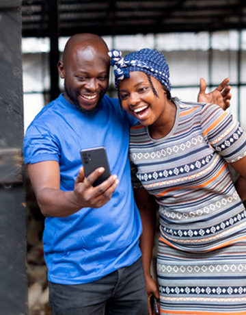 man blue tshirt, women looking at phone