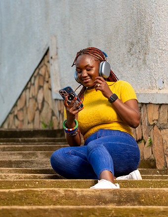 Woman listening to headphones using the Momo App